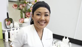 Person in a salon environment with beauty cosmetics